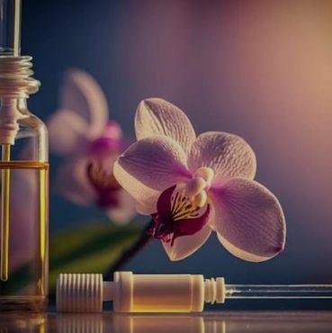 CALMIST BOTTLE OF ESSENTIAL OIL AND DROPPER AND FLOWERS