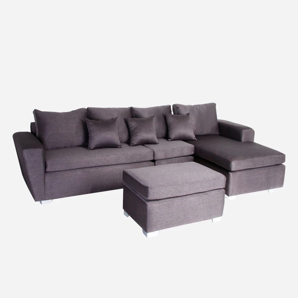 Modern gray sectional sofa with ottoman and multiple cushions.