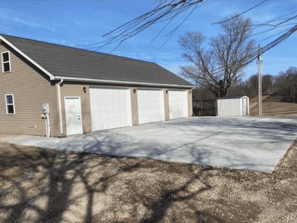 Concrete driveway construction in Owensboro with site prep & concrete pouring by KGC Construction.