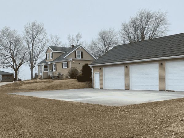 Concrete driveway construction in Owensboro, KY with site prep and concrete pouring by KAR-GAL.