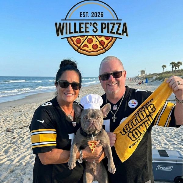 Couple and dog on beach promoting Willee's Pizza with Steelers gear.