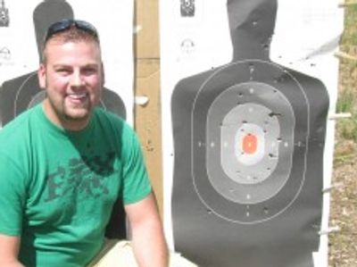 A smiling Wolf River Concealed Carry student after a successful shooting class!