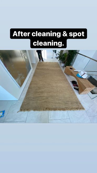 Oversized Oriental rug used as a statement piece in dining room