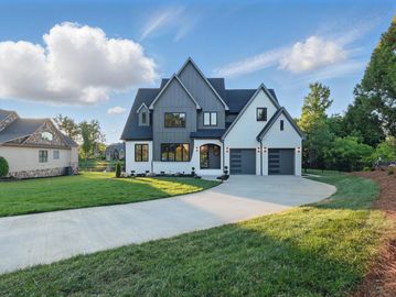 Featured in the Parade of Homes, this 5-bedroom, 4-bath lakefront showstopper is the ultimate blend