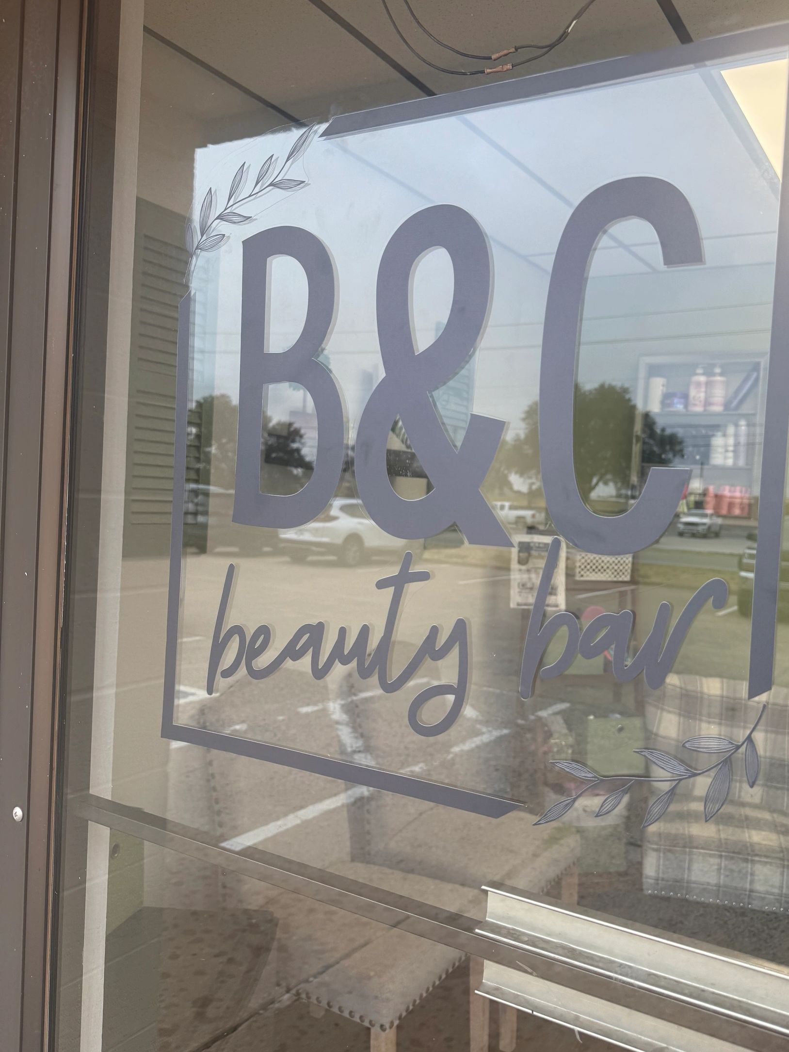 Glass door sign for B&C beauty bar.