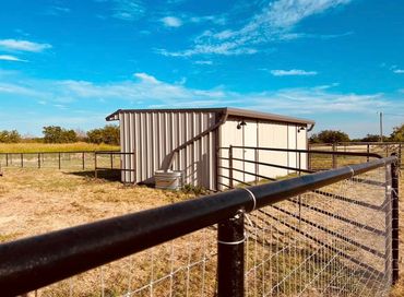 Pipe Fence And Metal Building
