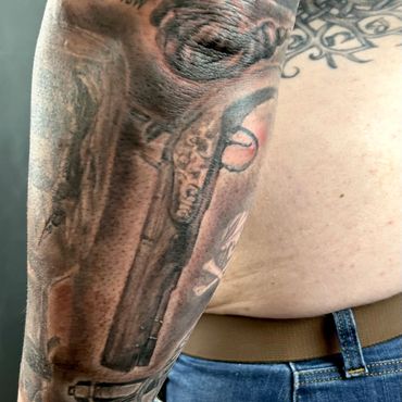 gun tattoo