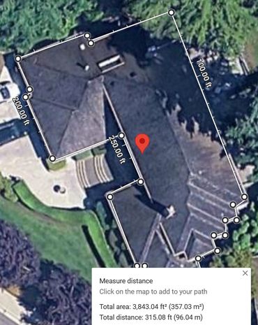 Aerial view of a large house with measured perimeter and area.