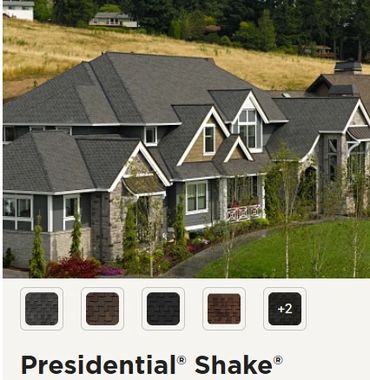 Large house with a complex roof design and Presidential Shake roofing.