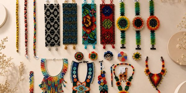 Colorful handmade beaded jewelry arranged neatly.