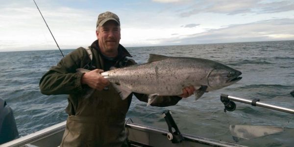 Captain Greg holding a king salmon