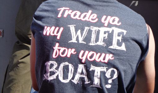 Man with shirt that says 'trade ya my wife for your boat'