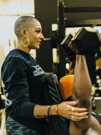 Personal training Coach T training a clients shoulders