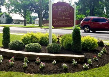 Summerhill Village condominium complex planting beds with stone wall