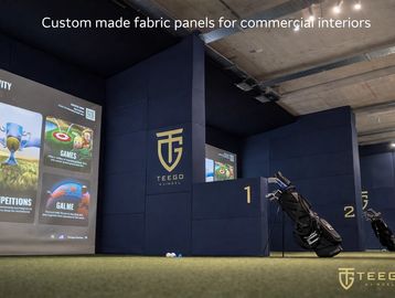 Bespoke fabric wall panels designed and manufactured for TeeGo commercial interiors, featuring precision textile fabrication and installation.