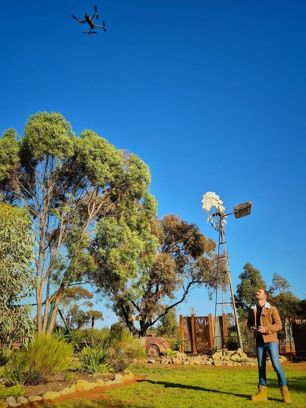 Drone Pilot operating a drone