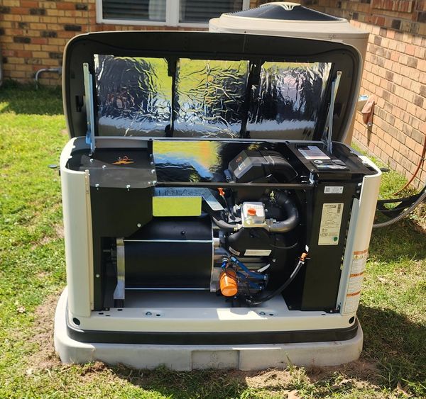 Open generator unit showing its internal components outdoors.