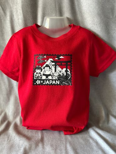 Red t-shirt with Japan-themed black and white graphic design.