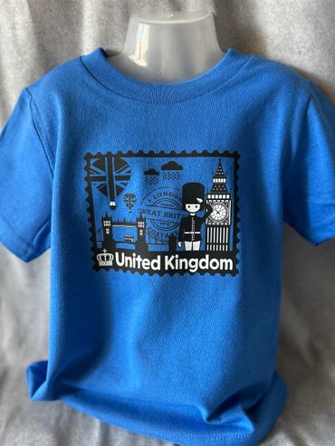 Blue t-shirt with United Kingdom London-themed print including Big Ben and a guard.