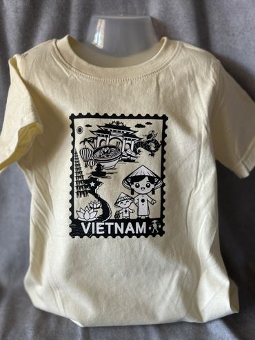 Beige T-shirt with black Vietnam-themed graphic print.