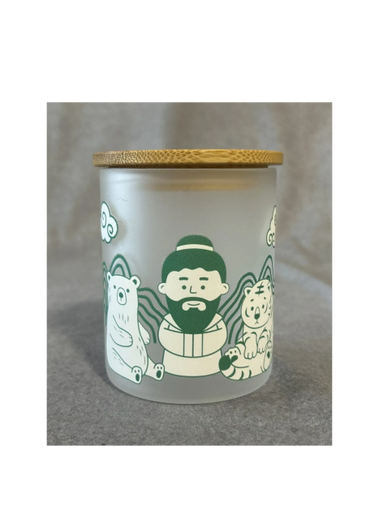 Frosted glass jar with wooden lid featuring cartoon animals and a bearded man.