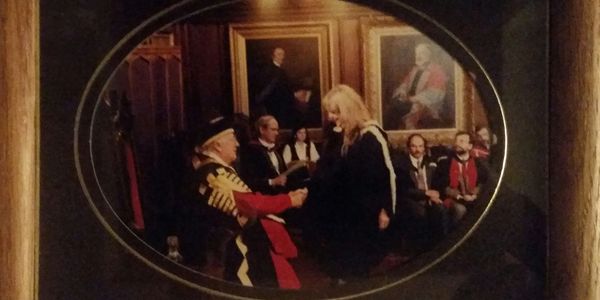 Receiving her degree from Peter Ustinov 