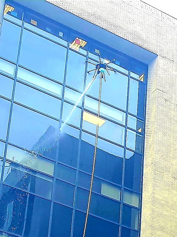 drone cleaning windows, pressure washing drone, drone wash building, lucid drone, apellix, DJI drone