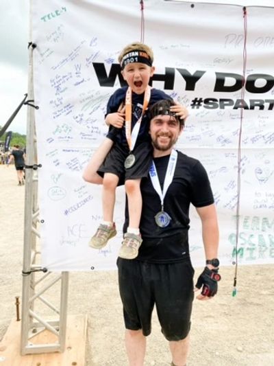 Rock City Fitness client Nathan and son giving Spartan Race success testimonial.
