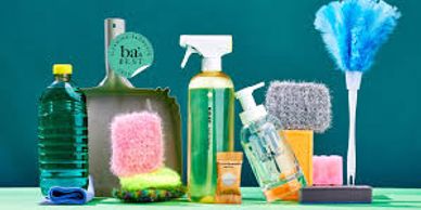 Various colorful cleaning supplies arranged against a teal background.