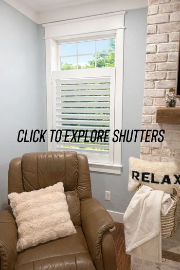 Cozy living room with white shutters and a leather armchair.