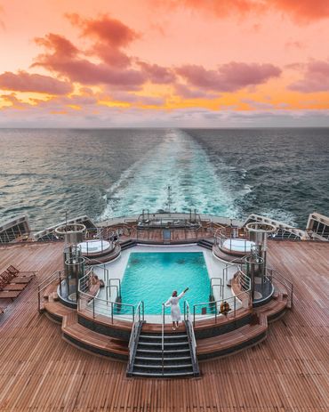 Sunset off cruise ship. Cunard cruise, princess, NCL, MSC, virgin voyages, Seabourn, Holland cruise