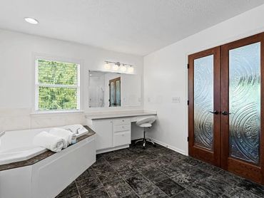 An image of an oversized bathroom painted white. A bathroom remodel in Springboro, Ohio.