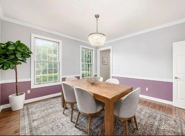 An image of a dining room using two colors with chair rail trim. Home located in Centerville, Ohio
