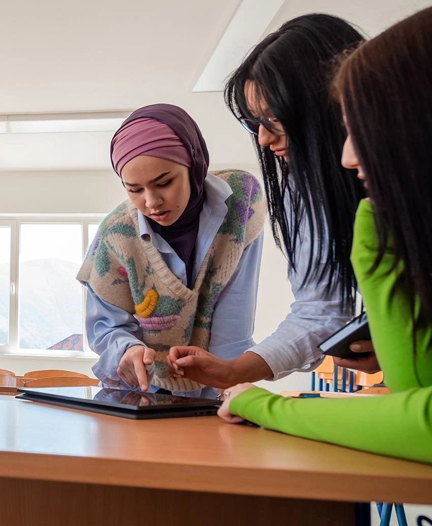 Women planning digital marketing together for their spiritual services.