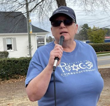 RevT speaking at rally