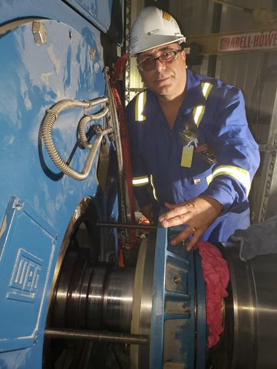 employee hard at work on a motor