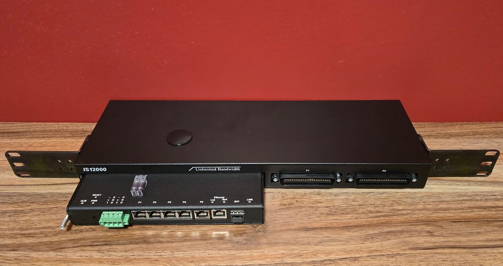 Unlimited Bandwidth LLC IS12000 TL1 SNMP E2AoIP Alarm System installed in a 1RU rackmount