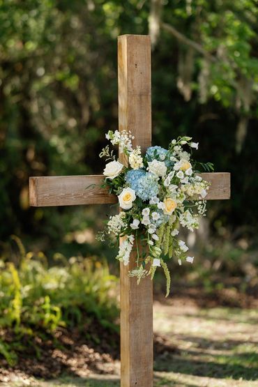 wedding ceremony cross floral arrangement