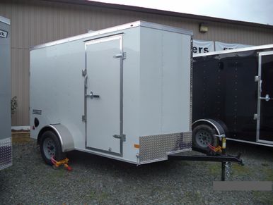 Haulmark 6x10' Passport Deluxe white enclosed utility trailer with rear double doors.