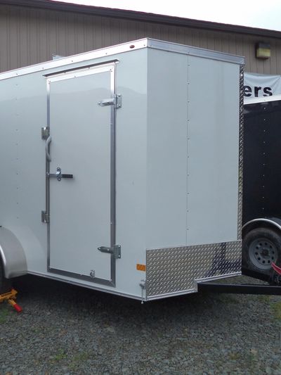 Haulmark Passport Deluxe 6x10 enclosed utility trailer, white with rear barn doors.