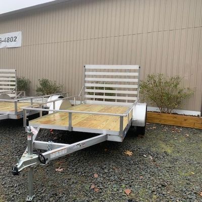 CargoPro 6x12' aluminum open utility trailer with rear ramp, wood deck.