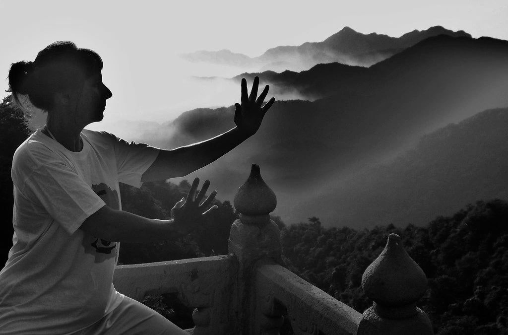Cherry Collins, pictured here training on Wudang Mountain, China, teaches Qigong on Fridays on Zoom