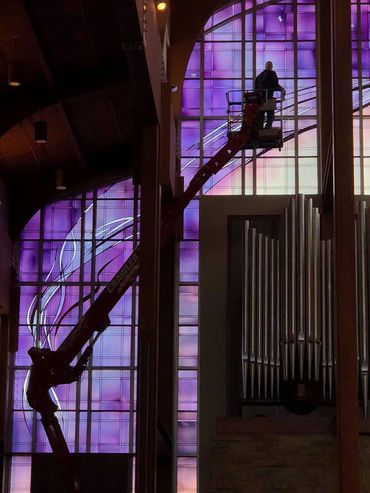 Installation of art glass at Holy Family Church in Fond du Lac, Wisconsin for Devereaux Architectura