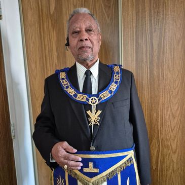Elderly man in Masonic regalia.
