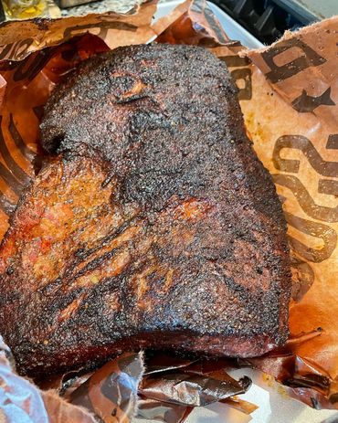 Smoked Pastrami Brisket wrapped in Peach Paper & Beef Tallow