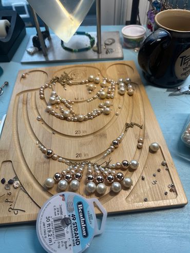 Pearl and hematite beads strewn out in the planning process.
