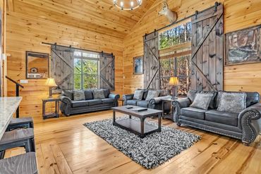 Pigeon Forge Cabin with custom wood barn doors by Adler Peak Enterprises