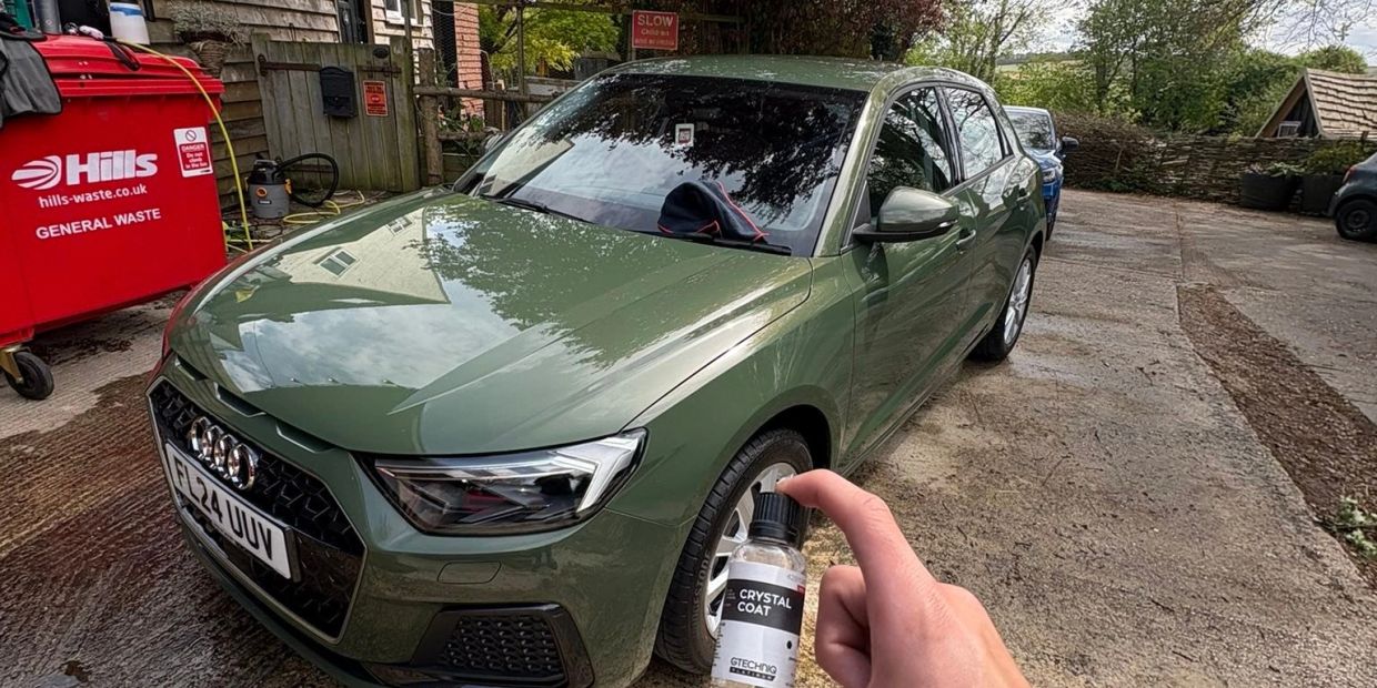 Green Audi car with Crystal Coat bottle.