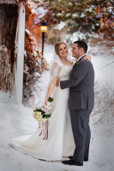Colorado winter wedding. Bride and groom in the snow