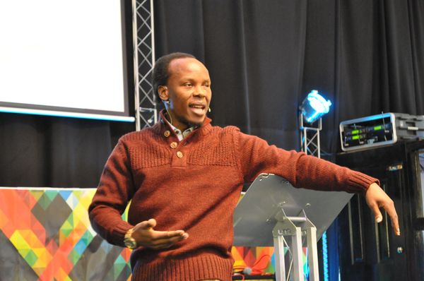 Pastor Anselme Shima speaking in a church in Belfast, UK.